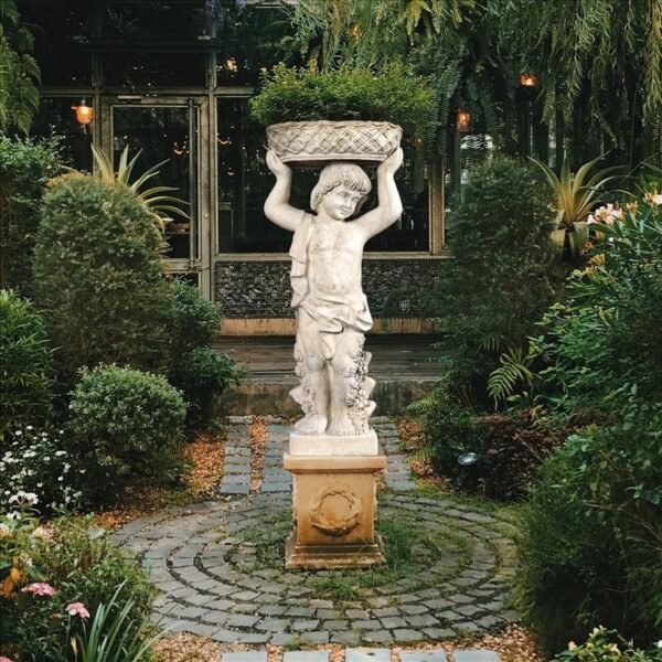 Design Toscano NE2101295 17 1/2 Inch Young Bacchus with Basket Planter Garden Statue - Left